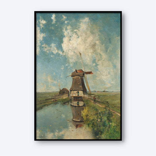 The "A Windmill on a Polder Waterway Print" features a framed painting that depicts a traditional windmill beside a serene polder waterway, complete with the windmill's reflection in the water. The scene includes expansive green fields under a sky dotted with scattered clouds, and additional small structures are visible in the distance, capturing the essence of this quintessential Dutch landscape.