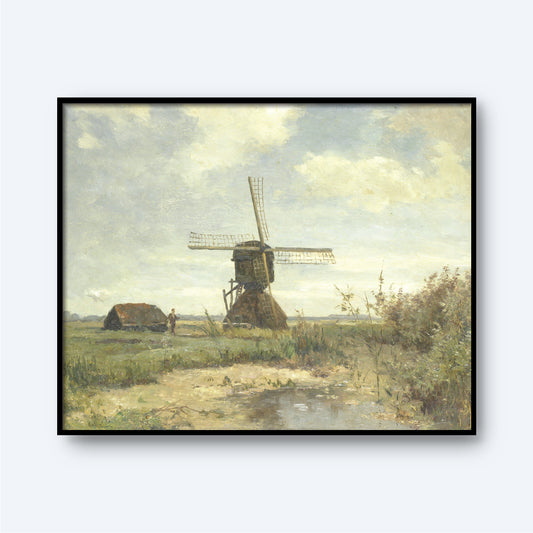 A framed painting titled "Sunny Day - a Windmill on a Waterway by Paul Gabriël" depicts a serene Dutch countryside scene. At the center, a windmill stands in a grassy field under a partly cloudy sky. A small house is visible to the left, accompanied by green foliage and a body of water in the foreground, capturing the essence of Paul Gabriël's art.