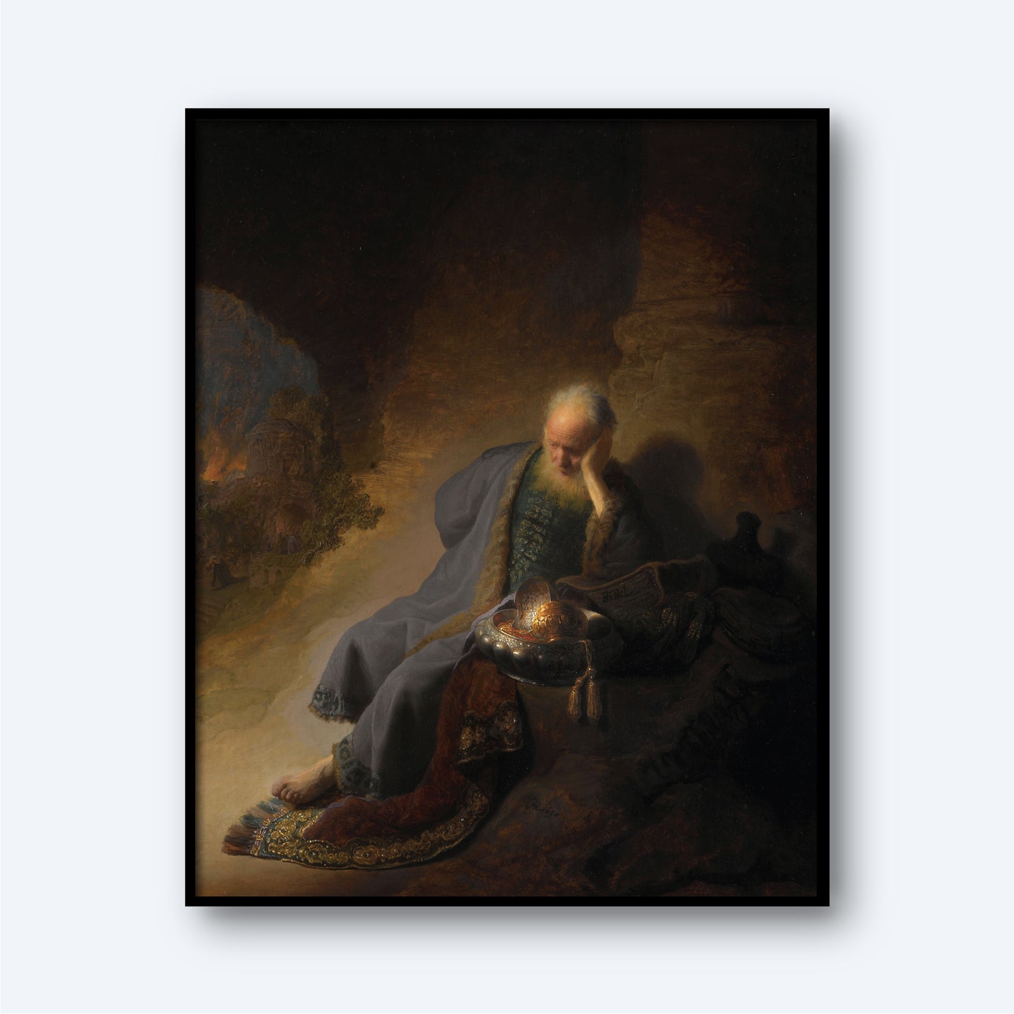 The painting "Jeremiah Lamenting the Destruction of Jerusalem" depicts a contemplative elderly man with white hair and a beard, seated in a dimly lit cave. Dressed in a long, dark blue robe, he leans his head on his hand in thought. Resembling the biblical prophet Jeremiah, he holds a scroll in his lap amid various objects.