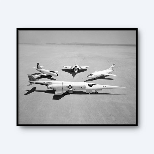 A black and white photograph titled "Group Photo of Douglas Aircraft Company Airplanes | X Planes" showcasing three experimental X-planes on a vast, flat desert surface. In the foreground is a sleek jet labeled "U.S. Air Force" with an "X" on its tail, symbolizing aviation history. Behind it, two smaller aircraft from the Douglas Aircraft Company are positioned in a triangle formation.
