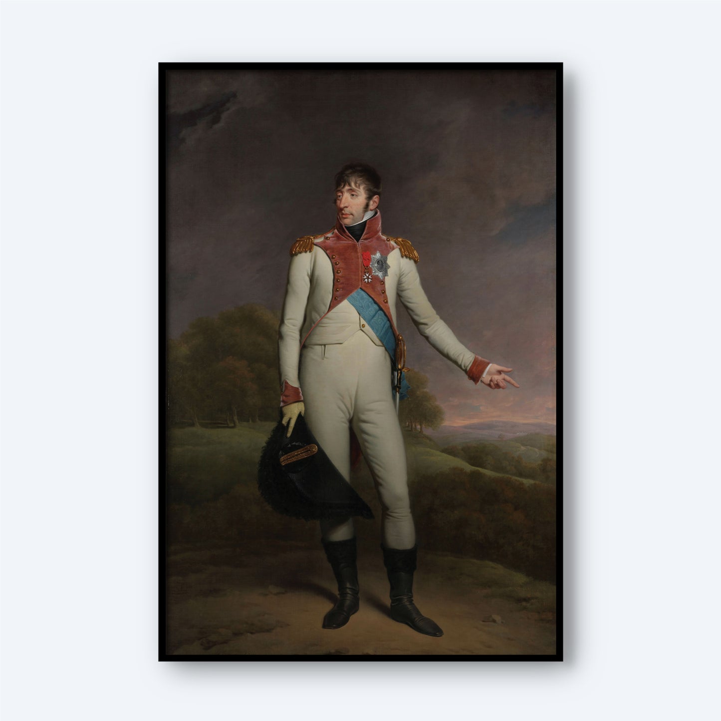 The "Portrait of Louis Napoleon - King of Holland" by Charles Howard Hodges depicts Louis Napoleon in a historical military uniform, complete with a red and blue sash, gold epaulets, and white pants. He is standing outdoors holding a black hat in his left hand while extending his right hand as if gesturing against a serene landscape backdrop.