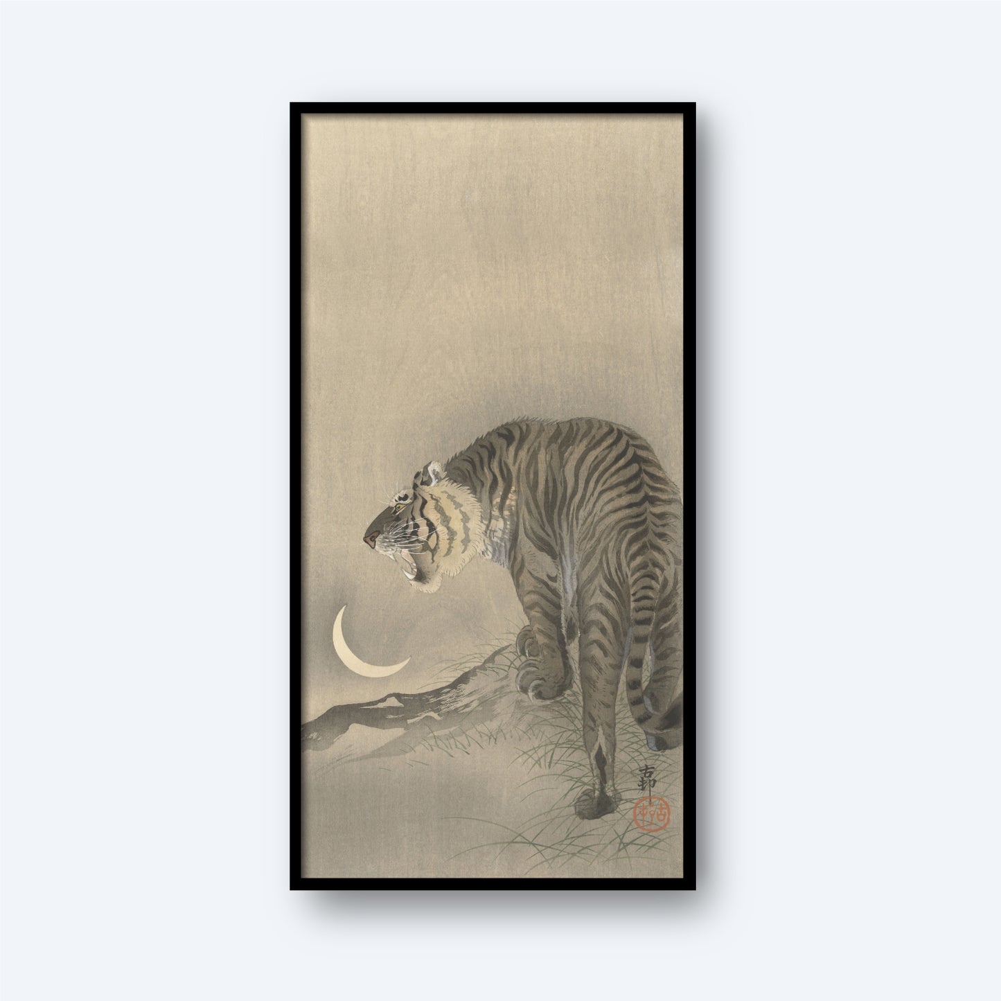 A piece titled "Roaring Tiger by Koson Ohara" showcases a framed artwork of a roaring tiger with its mouth open, poised on a rocky surface and facing a crescent moon. The subdued, monochromatic color palette and intricate, traditional style beautifully evoke the essence of Japanese woodblock printing. The artist's signature is visible in the lower right corner.