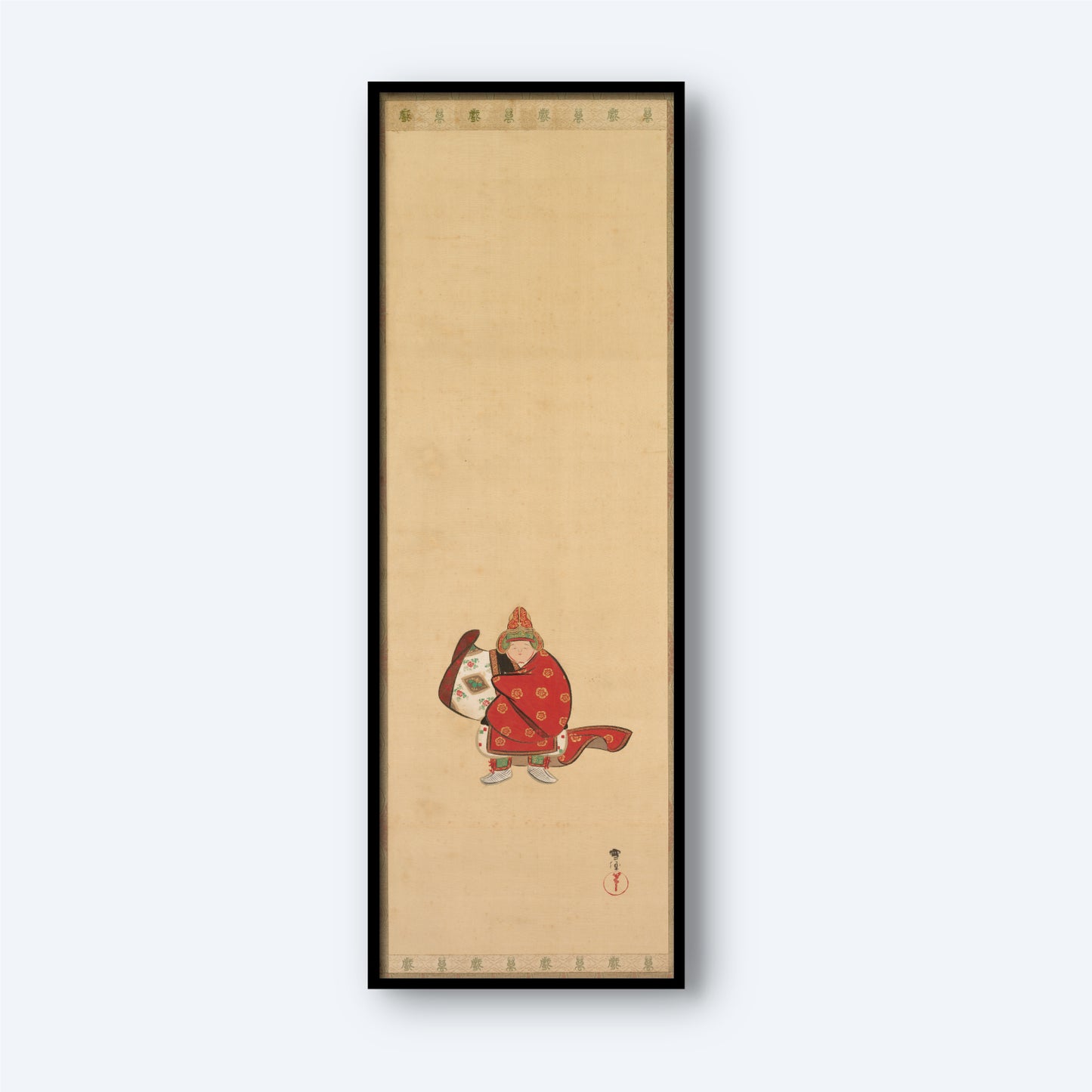 The "Bugaku Dancer by Kamisaka Sekka Print" is a rectangular framed artwork showcasing two stylized figures in traditional Asian attire, evocative of Bugaku dancers, embellished with red and gold. Positioned against a light beige background, the piece features intricate designs and calligraphy at the top and bottom.