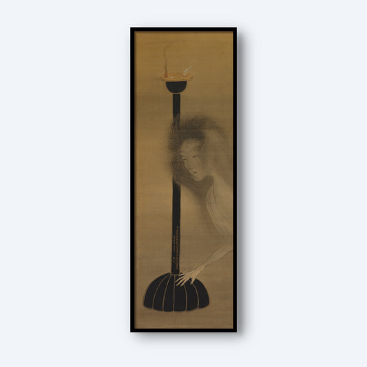Ghost and Oil Lamp by Tani Bun'ichi" is a vertical artwork framed in black, showcasing a ghostly figure with pale, ethereal features gazing solemnly at a tall, thin oil lamp holding a single burning candle. The background and details are muted in earthy tones, creating a haunted yet serene atmosphere characteristic of Bun'ichi's style.