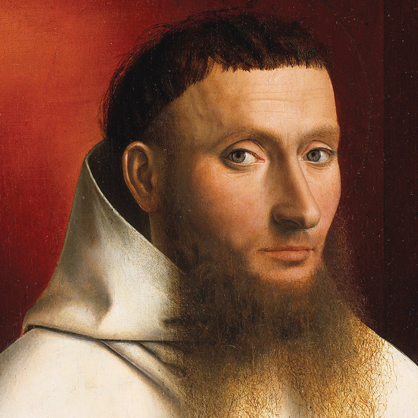 The artwork "Portrait of a Carthusian" by Petrus Christus features a close-up view of a bearded man clad in a white robe with a hood. His head is turned slightly to the side, and his solemn expression echoes the style of 15th-century Flemish portraiture. The background transitions from dark to lighter shades, offering a warm contrast that highlights the subject.