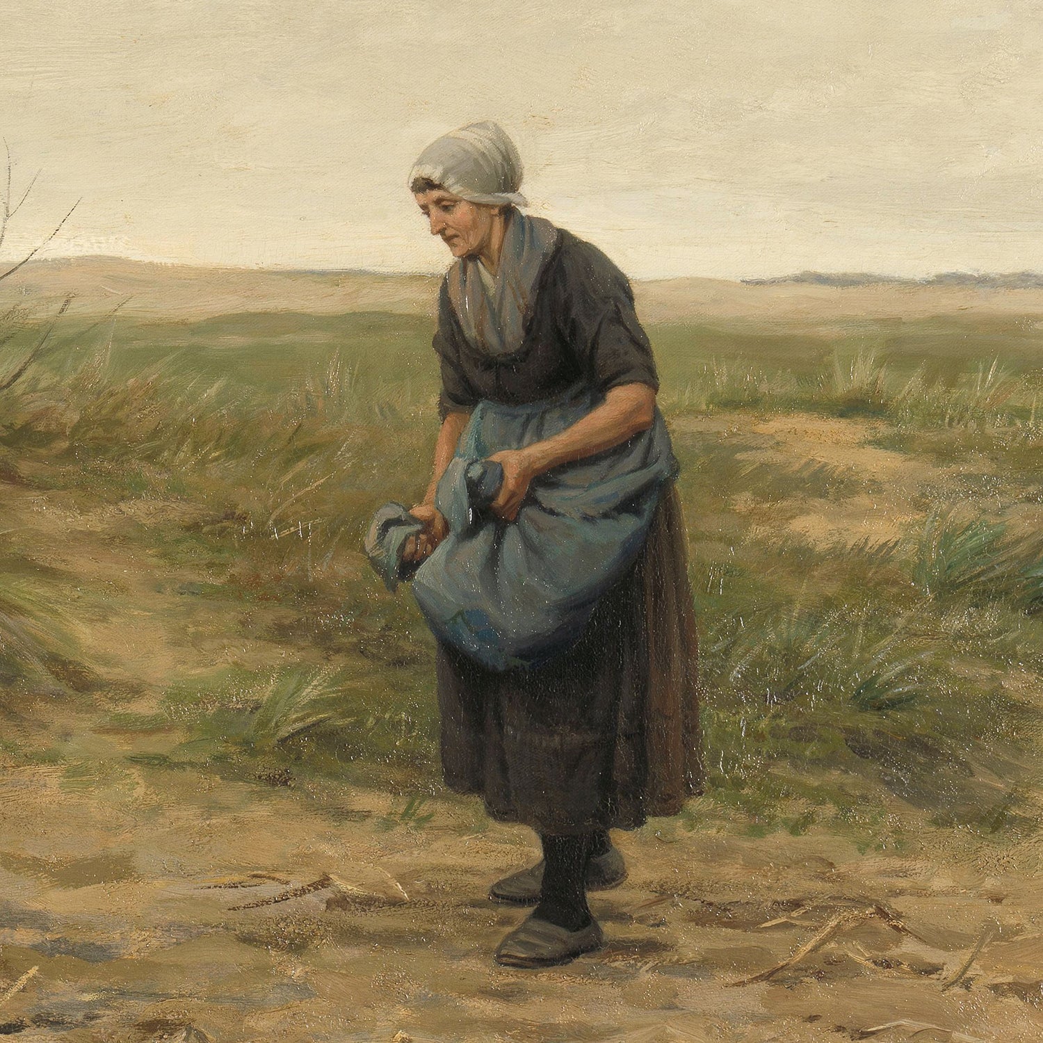 The "Peasants Digging Print" portrays a woman adorned in a headscarf and a dark dress with an apron, standing in an open field. Embodying the essence of rural labor, she clutches a sizable blue sack or bundle with both hands, leaning slightly forward as if she is either placing something on the ground or gathering items from it.