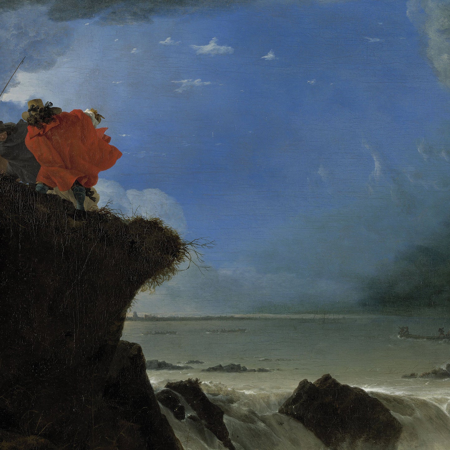 In "The Breach of the Saint Anthony’s Dike near Amsterdam Print," two figures stand at the edge of a cliff overlooking a stormy sea. One figure wears a billowing red cloak, while the other holds a staff. Dark clouds loom above, contrasting with a patch of blue sky and turbulent waves below, invoking Dutch history painting vibes in this dramatic piece of natural disaster art.