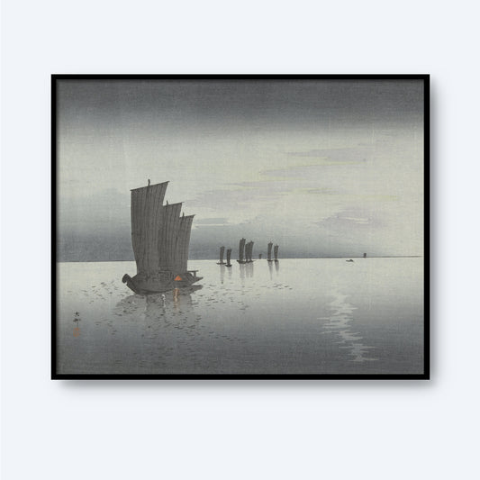 The "Ohara Koson – Fishing Boats at Sea" is a serene wall art piece depicting a calm, foggy seascape with traditional Japanese sailboats. The muted colors and soft brushstrokes evoke the minimalist beauty of Japanese woodblock printing, creating a peaceful atmosphere as the boats drift across the water, with subtle reflections shimmering on the surface.