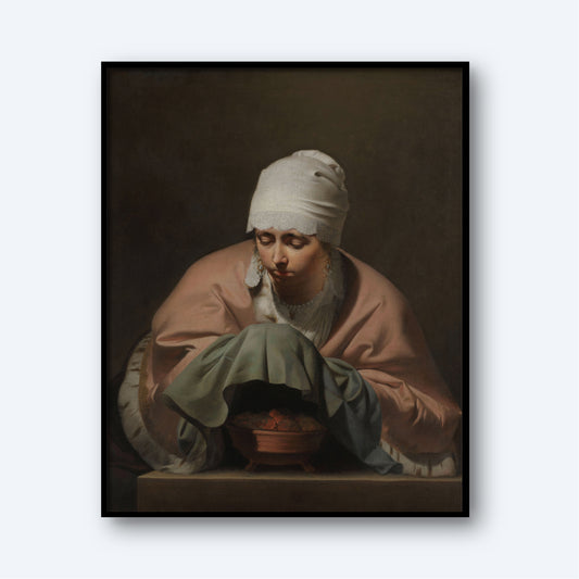 A print titled "Young Woman Warming her Hands over a Brazier" by Caesar van Everdingen features a woman with a white headscarf and pink shawl leaning over a pot. She has a contemplative expression and holds a green cloth, while the dark background emphasizes her and the pot. This Dutch Golden Age artwork comes framed in black.