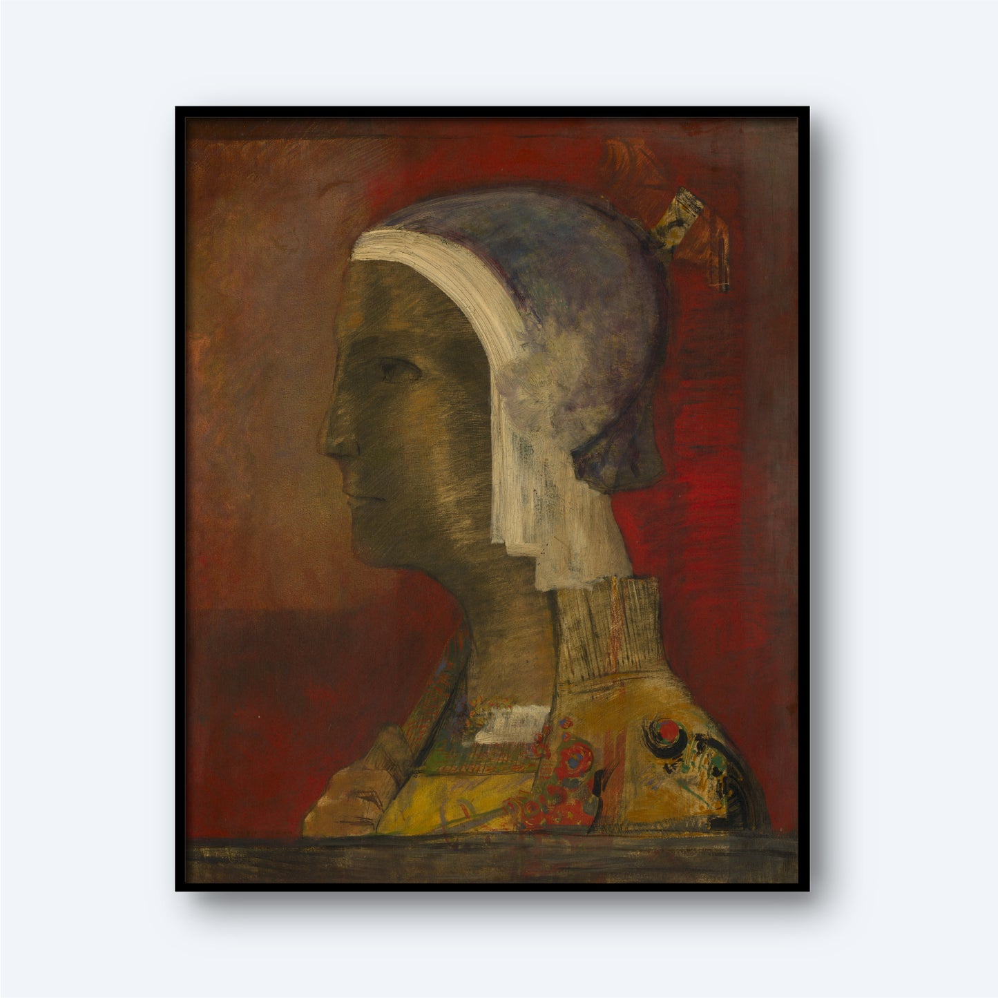 Product Description: The framed painting, "Symbolic Head by Odilon Redon," features a figure in profile set against a muted red background. The figure is adorned with a headscarf and patterned garment. This artwork is evocative of the Symbolist movement, reflecting Odilon Redon's distinctive style with its textured abstract elements and emphasis on earth tones and subtle details.
