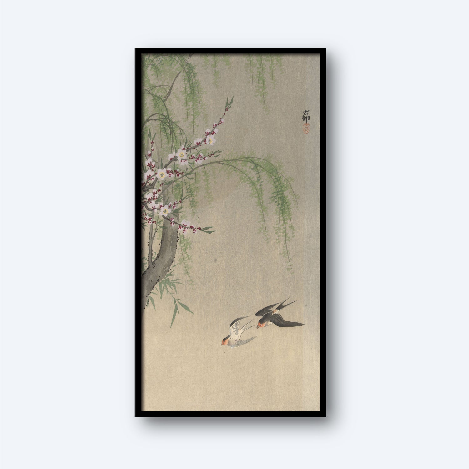 The "Swallows in Flight by Ohara Koson Vintage Japanese Print" features a framed depiction of swallows soaring near a tree branch adorned with delicate pink blossoms and wispy green leaves. The background is a soft beige, and the artwork bears an Ohara Koson signature in the top right corner.