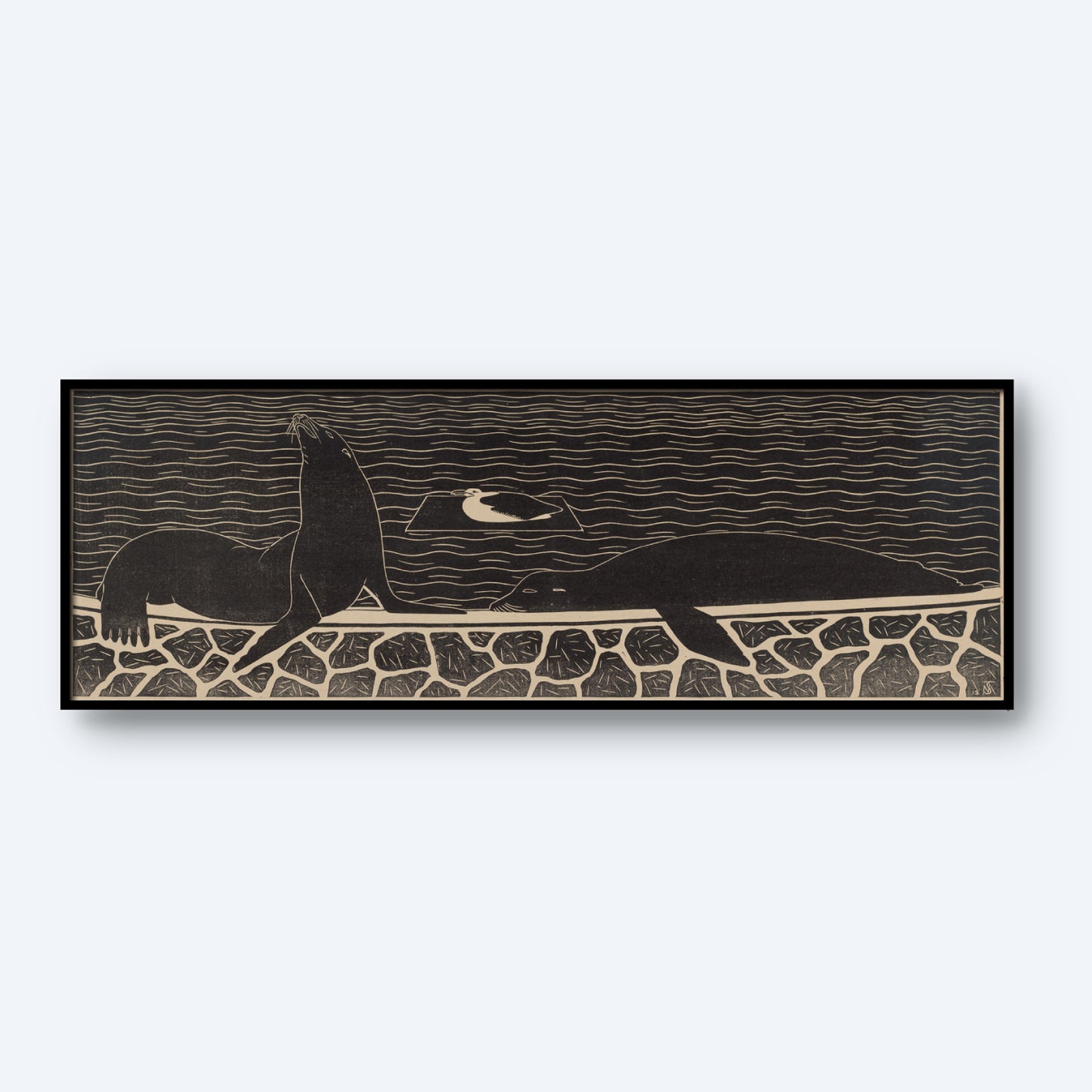 The "Sea Lions by Samuel Jessurun de Mesquita Print" is a black and white framed artwork that showcases a seal and a bird on a stone wall with the ocean as the backdrop. The seal sits upright on the left, while the bird stands to its right, with wavy lines representing water in the background.