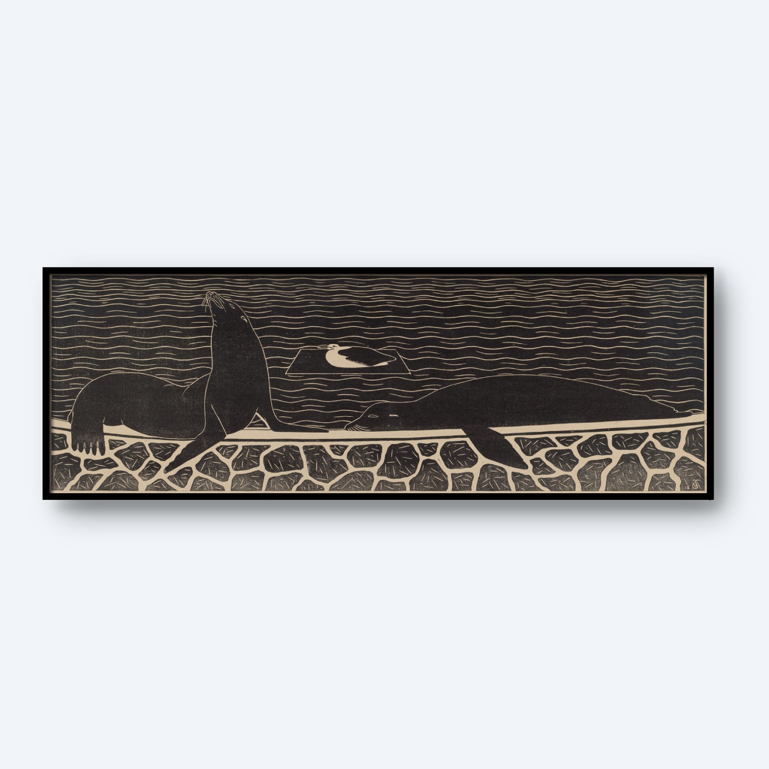 The "Sea Lions by Samuel Jessurun de Mesquita Print" is a black and white framed artwork that showcases a seal and a bird on a stone wall with the ocean as the backdrop. The seal sits upright on the left, while the bird stands to its right, with wavy lines representing water in the background.