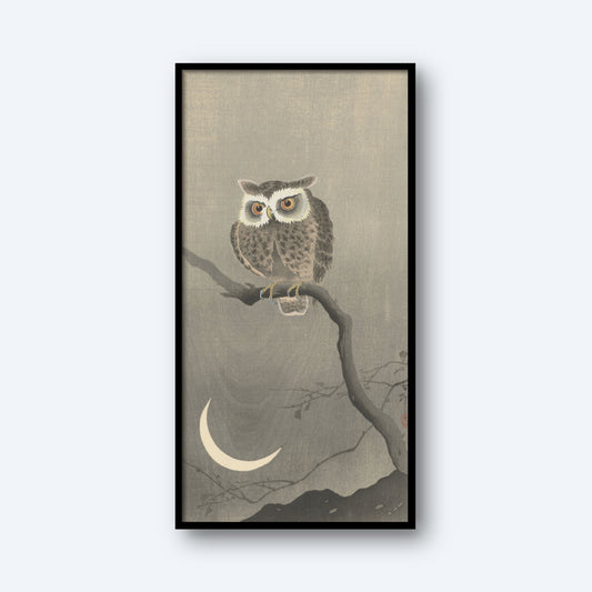 The framed product, titled "Long-eared Owl on Bare Tree Branch by Ohara Koson Vintage Japanese Print," showcases a Long-eared Owl perched on a bare branch against a gray background. Below the owl is a crescent moon, and faint outlines of mountains can be seen at the bottom, evoking the serene nighttime ambiance reminiscent of Ohara Koson's vintage Japanese prints.