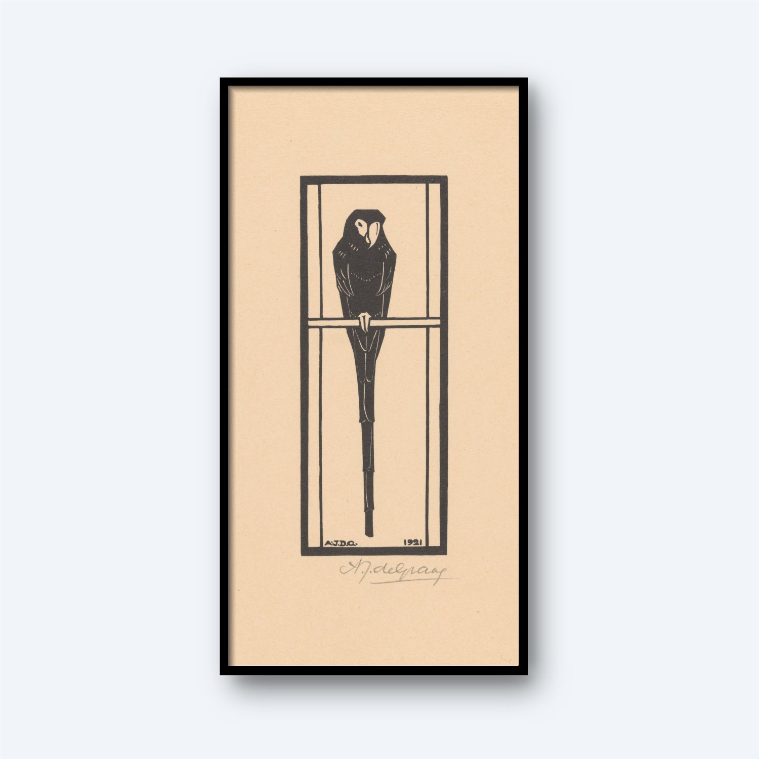 The "Ara by Julie De Graag | Vintage Print" is a framed piece showcasing a stylized, monochromatic illustration of an owl perched on a branch. This artwork, dated "1911" and signed by the artist, stands out against a beige background with a black border, embodying a simple and minimalist design.
