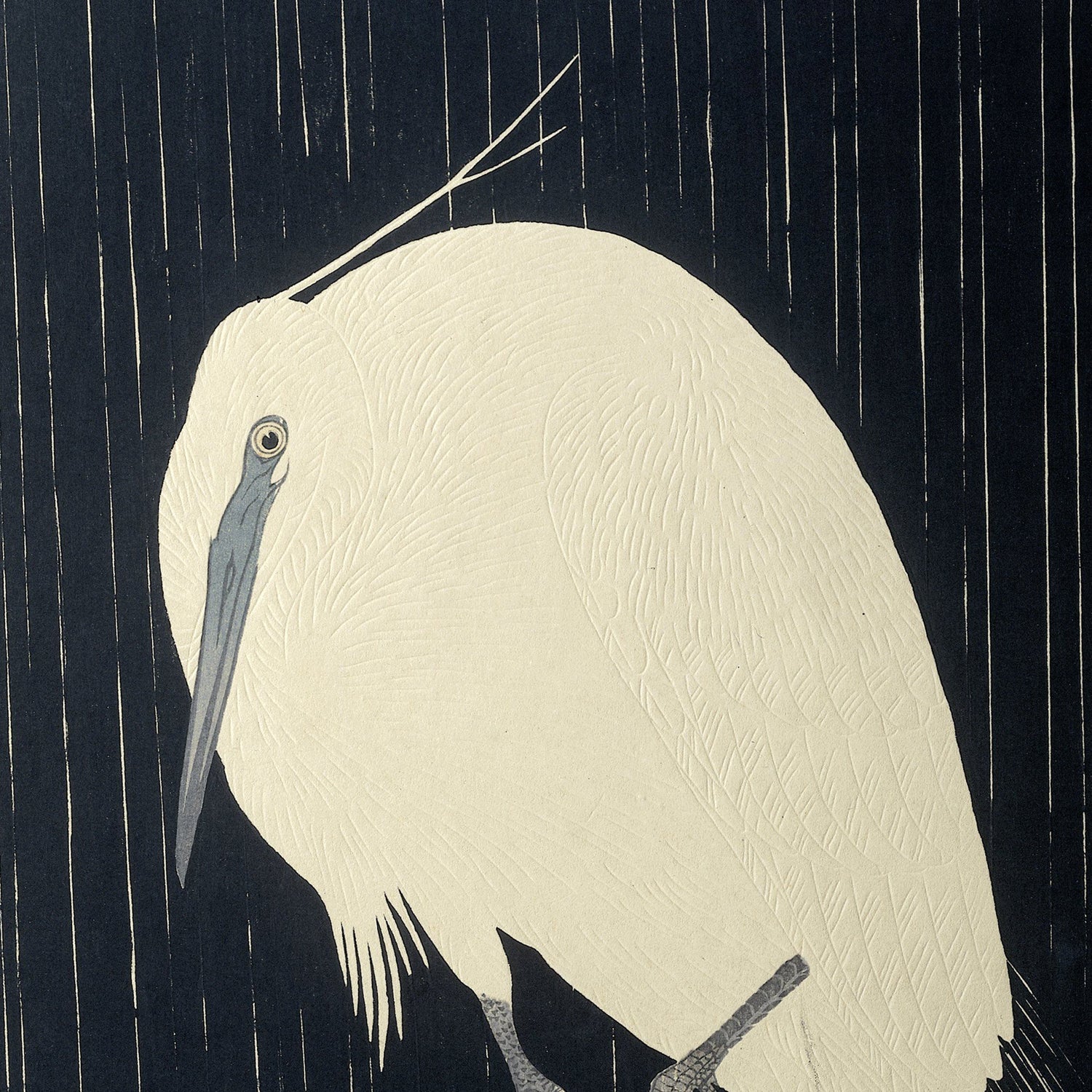 The "Egret in the Rain by Ohara Koson | Vintage Japanese Print" beautifully captures a white egret with intricate feather patterns, set against a dark background featuring vertical lines that resemble rain. This detailed and stylized side profile of the egret showcases its long, pointed beak and slender neck, reminiscent of Koson's renowned Japanese woodblock prints.